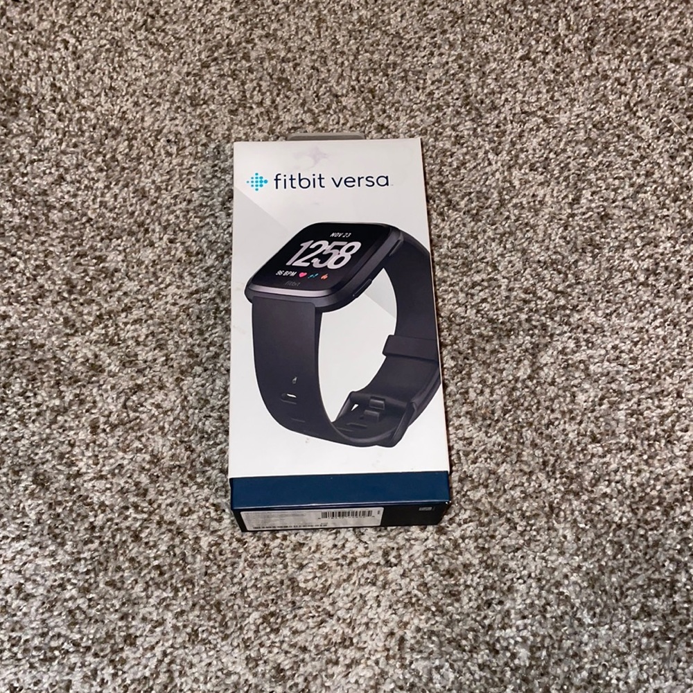 Fitbit Versa with charging stand